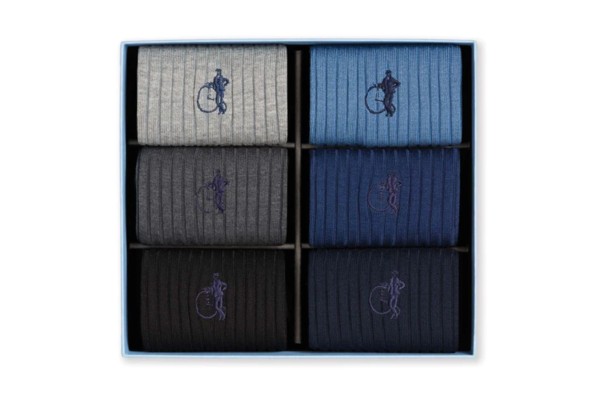 A box of six pairs of ribbed socks in various shades of grey and blue, each with an embroidered logo of a man on a penny-farthing bicycle.