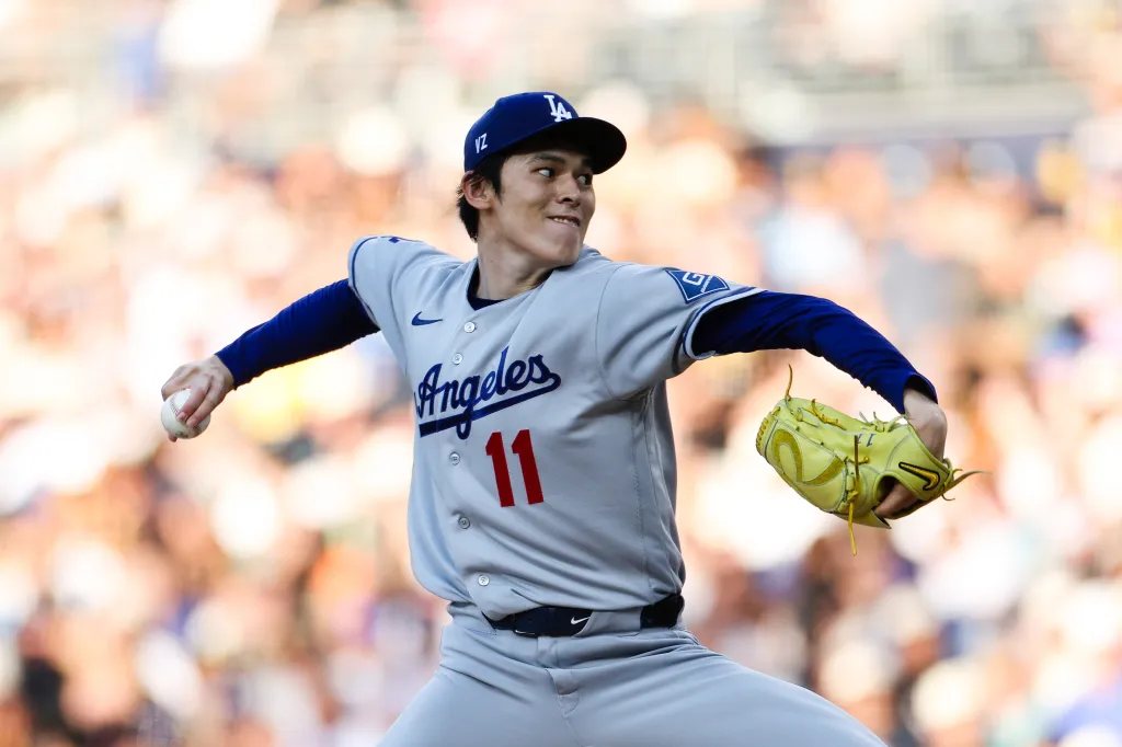 Los Angeles Dodgers pitcher Roki Sasaki delivering a pitch against the San Diego Padres.