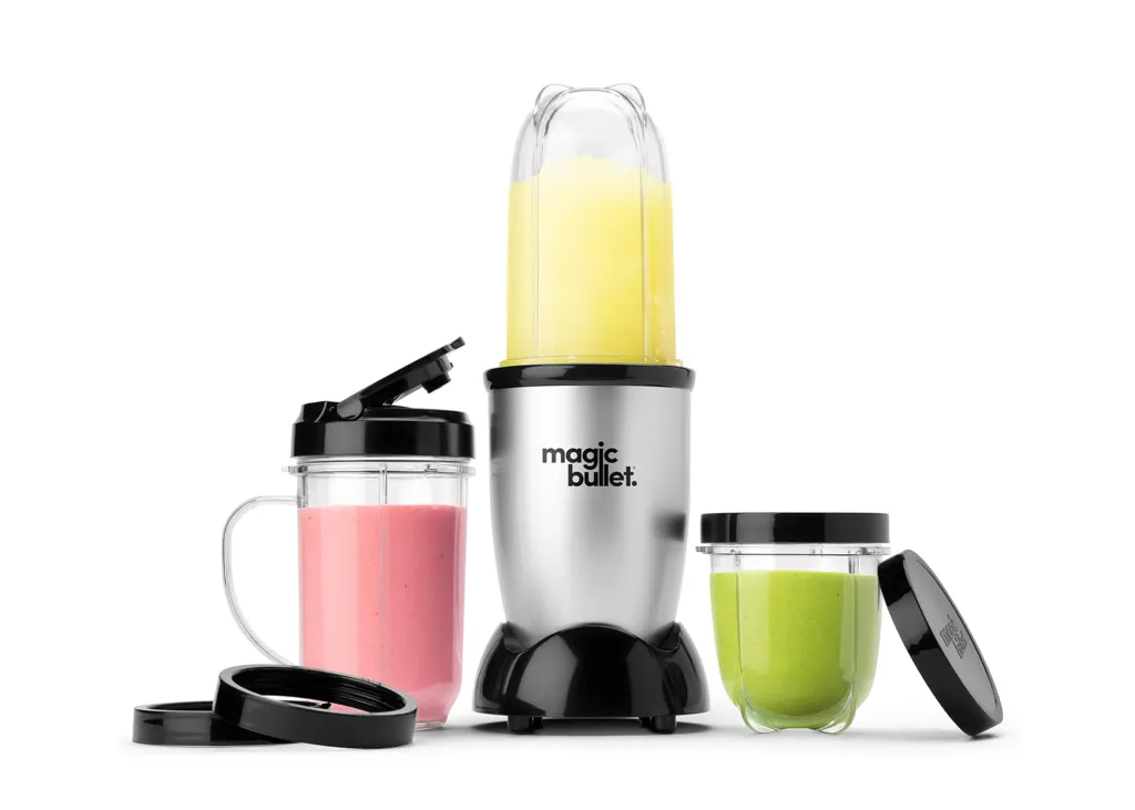 Magic Bullet blender with three containers of smoothies.