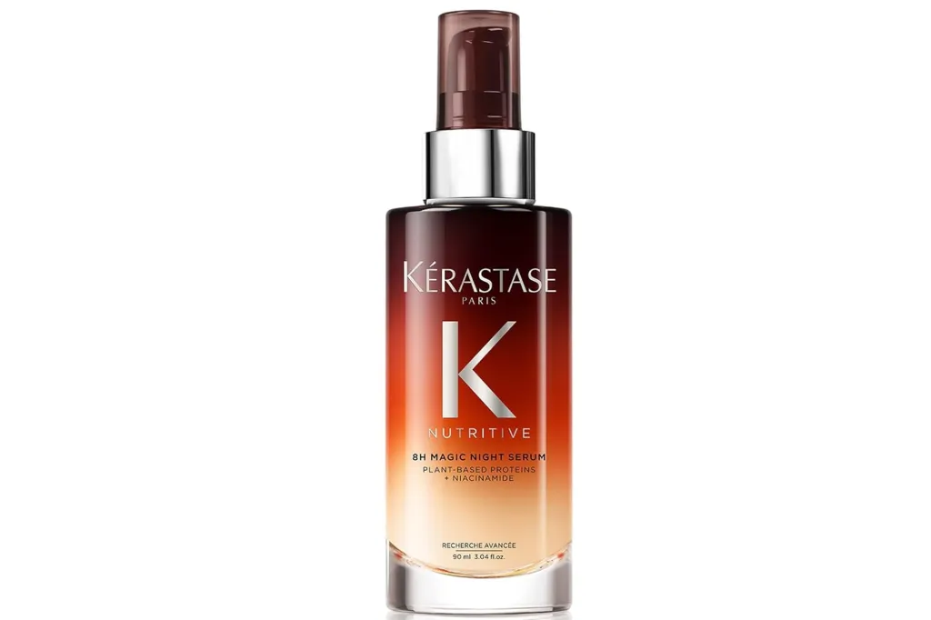 A bottle of Kérastase Nutritive 8H Magic Night Serum with plant-based proteins and niacinamide.