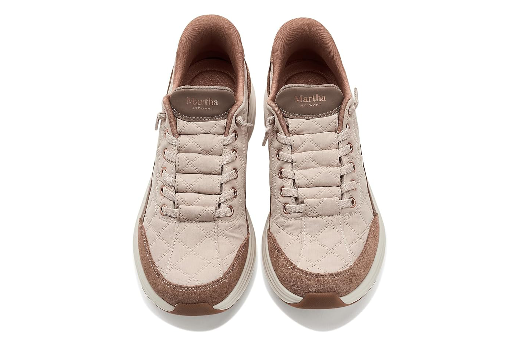 Pair of Martha Stewart Skechers sneakers in beige with quilted texture.