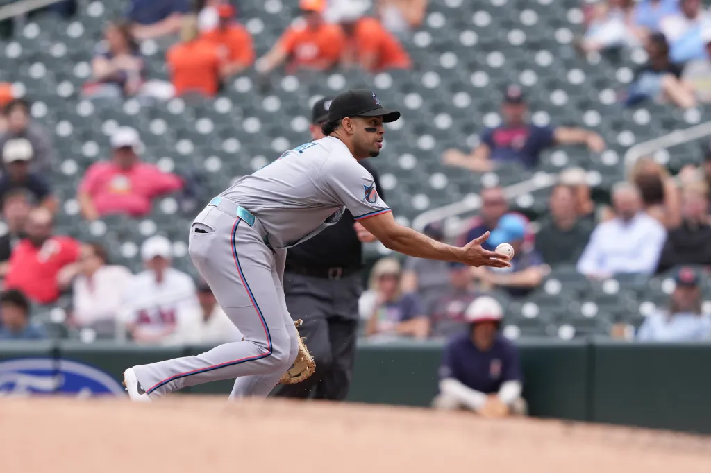 Miami Marlins first baseman Christopher Morel (5) tosses the ball to first base.
