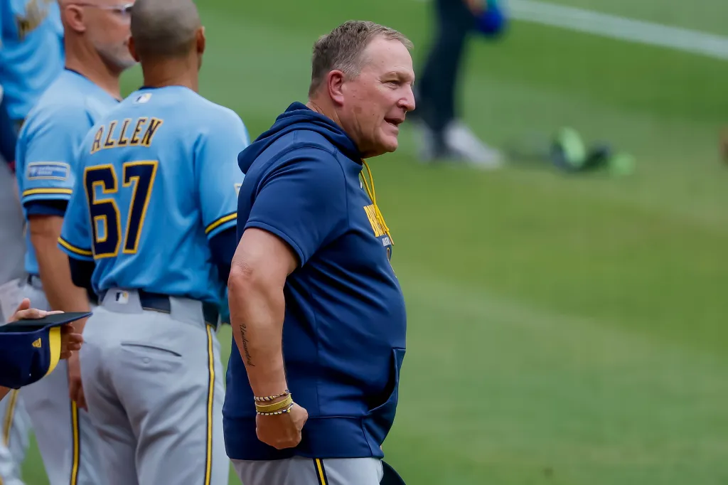 Milwaukee Brewers manager Pat Murphy on the field during the national anthem.