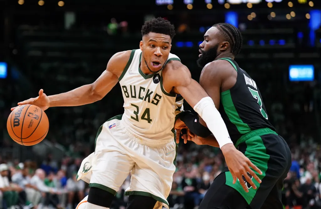Milwaukee Bucks forward Giannis Antetokounmpo (34) drives the ball against Boston Celtics guard Jaylen Brown (7).