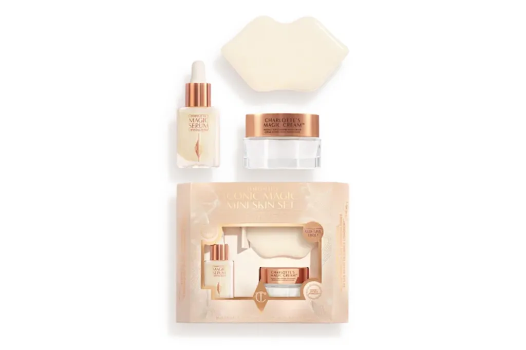 Charlotte Tilbury's Iconic Magic Mini Skin Set, featuring serum, magic cream, and a gua sha tool.