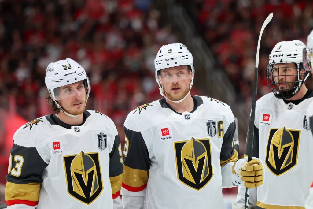 Mitch Marner, Jack Eichel, and another Vegas Golden Knights player on the ice during a Stanley Cup Final game.