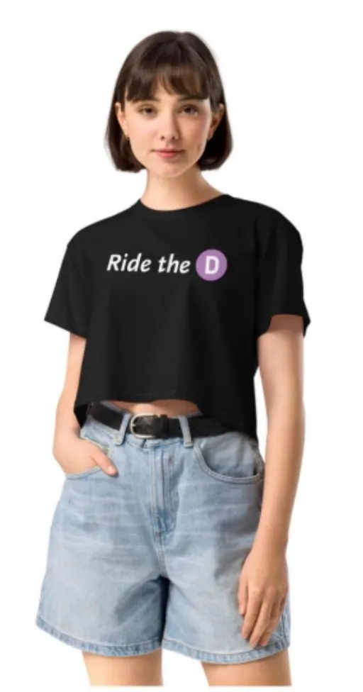 A model wears a black "Ride the D" T-shirt, which has a purple circle logo.