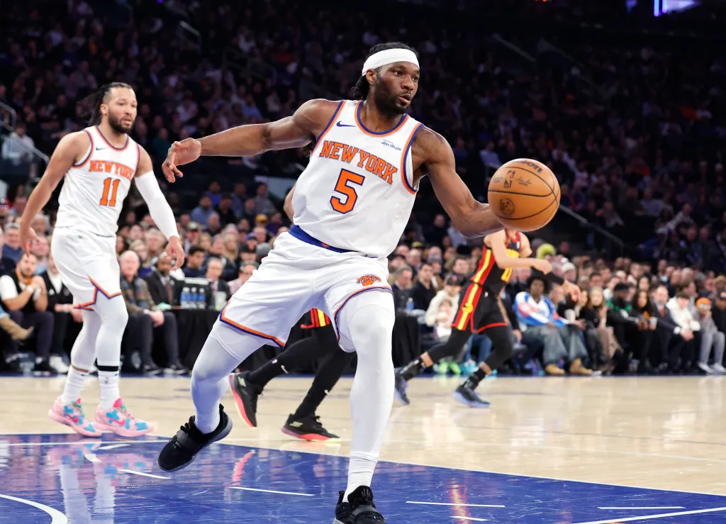 New York Knicks forward Precious Achiuwa rebounds the ball.