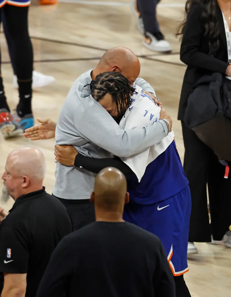 Game 5 of the 2026 NBA Finals: New York Knicks guard Jalen Brunson (11) celebrates with his father assistant coach Rick Brunson after becoming the 2026 NBA Finals Champions.

