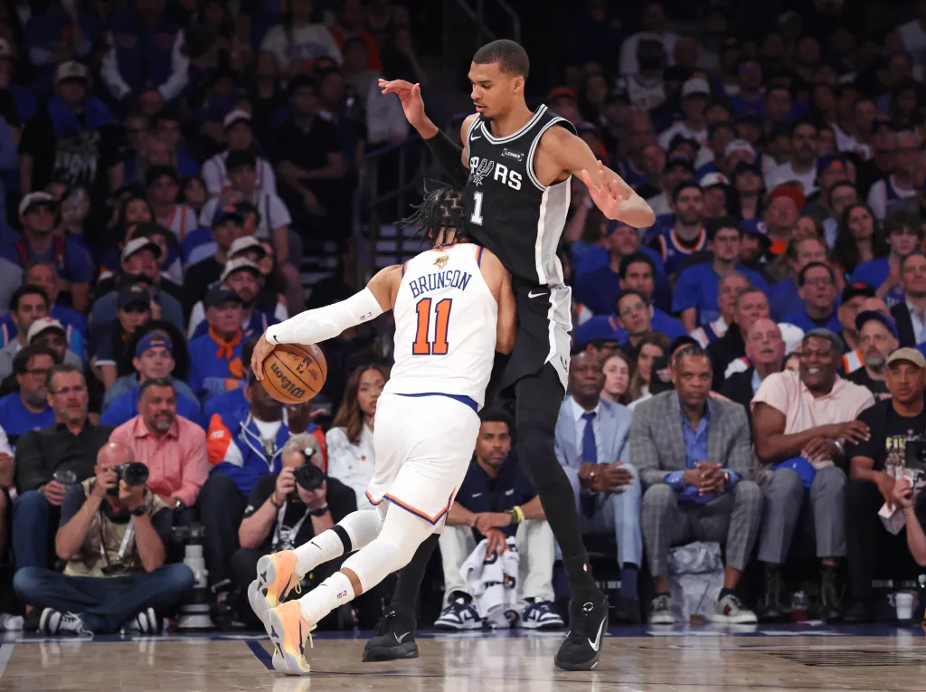New York Knicks vs. San Antonio Spurs at Madison Square Garden - San Antonio Spurs forward Victor Wembanyama #1 defends against New York Knicks guard Jalen Brunson #11 during the second quarter.
