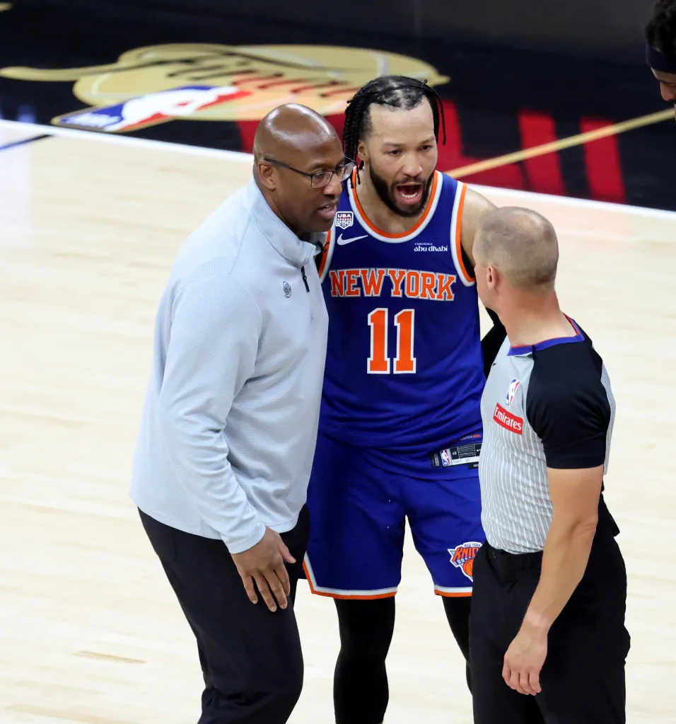 Knicks head coach Mike Brown (l.) and guard Jalen Brunson (11) talks to a referee during Game 5 of the NBA Finals against the Spurs on June 13, 2026.