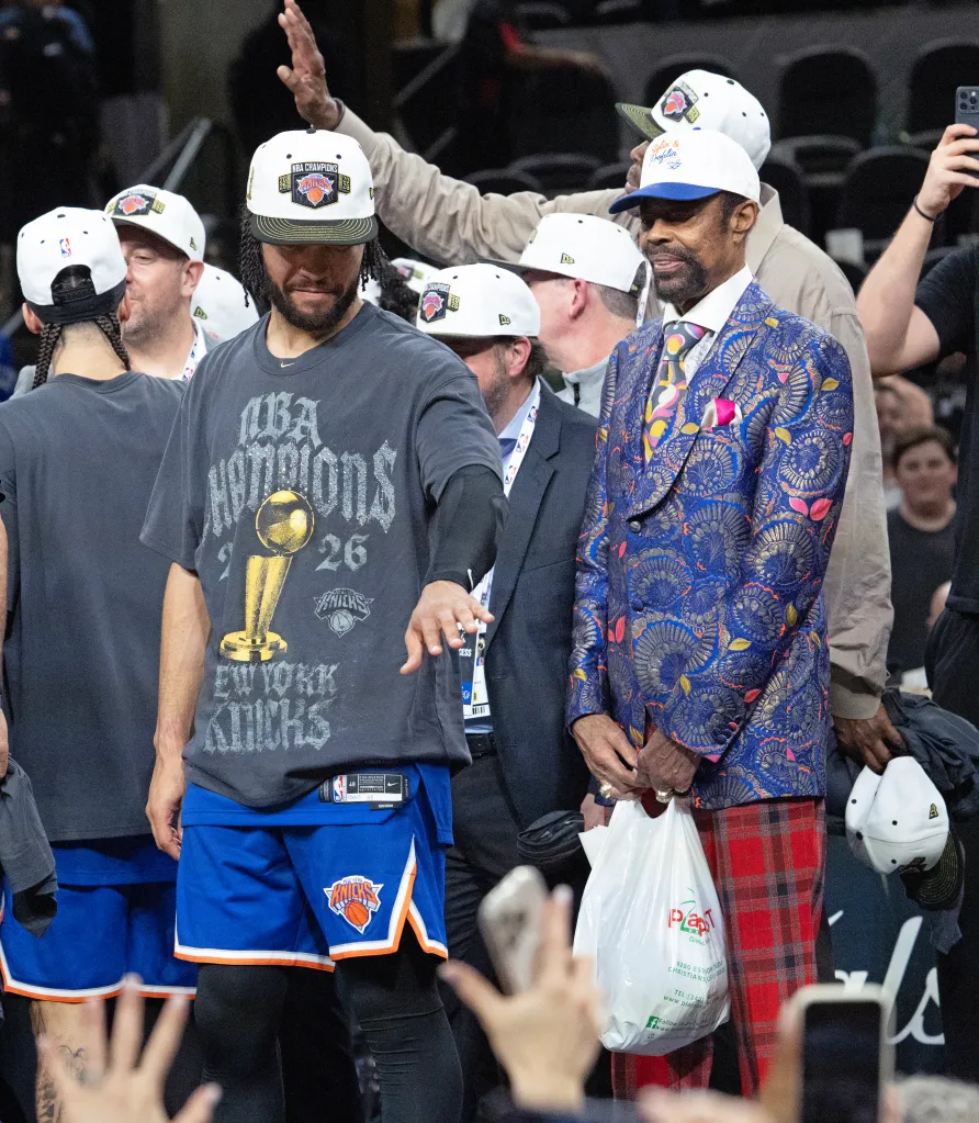 Jalen Brunson and Walt Frazier of the New York Knicks celebrate after winning the NBA Finals.