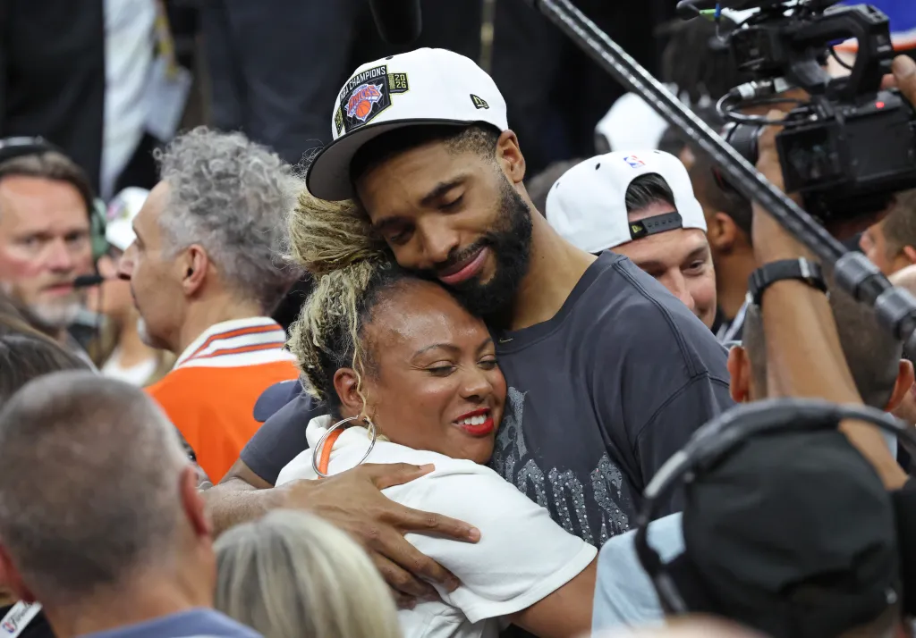 Mikal Bridges #25, getting a hug after the Knicks defeated the Spurs to win the NBA Championship.
