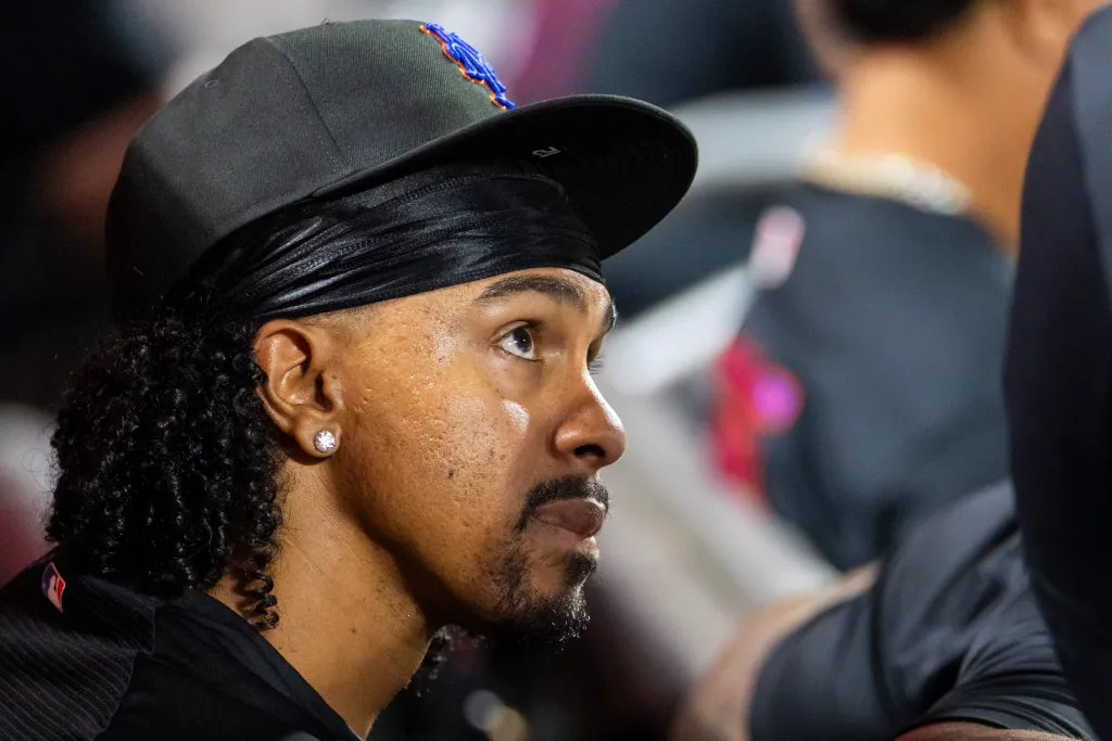 Francisco Lindor sitting in the dugout.