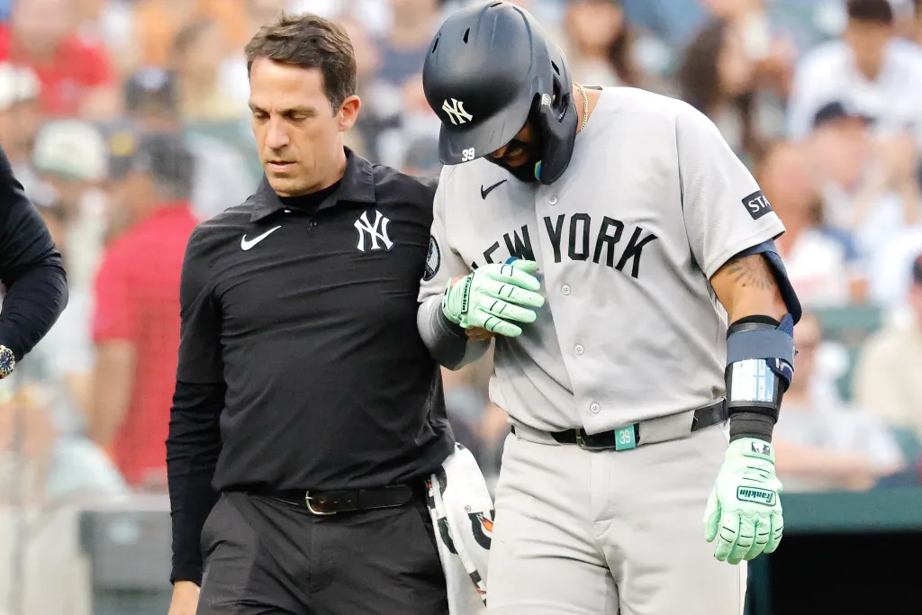 New York Yankees catcher Ali Sanchez (39) leaves the game after being hit by a pitch.