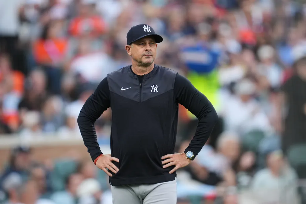 New York Yankees manager Aaron Boone watching a baseball game.