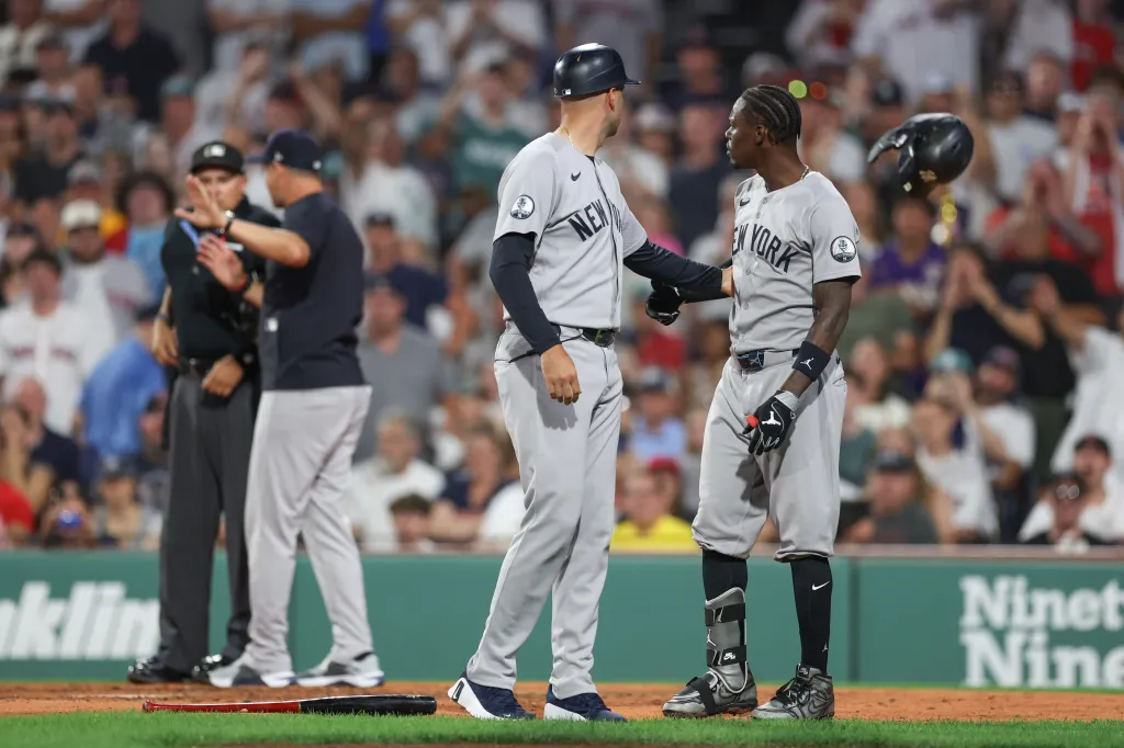 New York Yankees second baseman Jazz Chisholm Jr. argues with home plate umpire Adam Hamari.