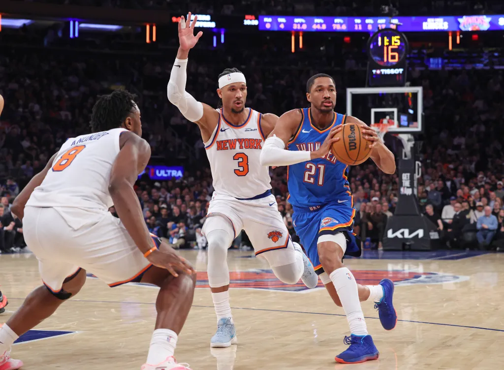 Oklahoma City Thunder guard Aaron Wiggins (21) looks to pass the ball as New York Knicks guard Josh Hart (3) defends.