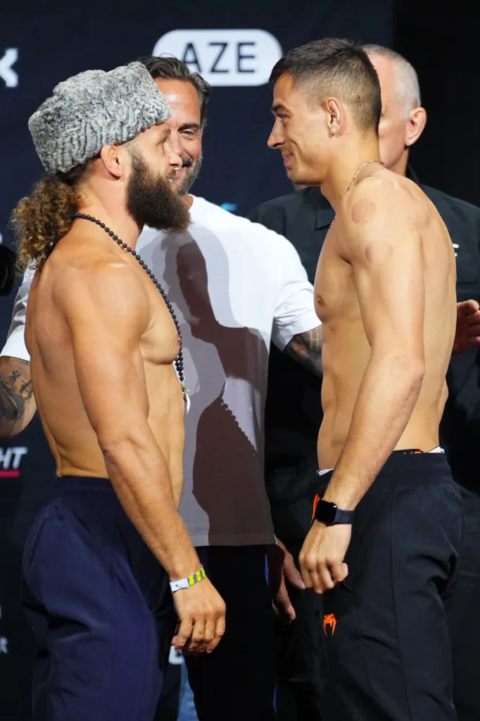 UFC fighters Rafael Fiziev and Manuel Torres face off at a weigh-in.