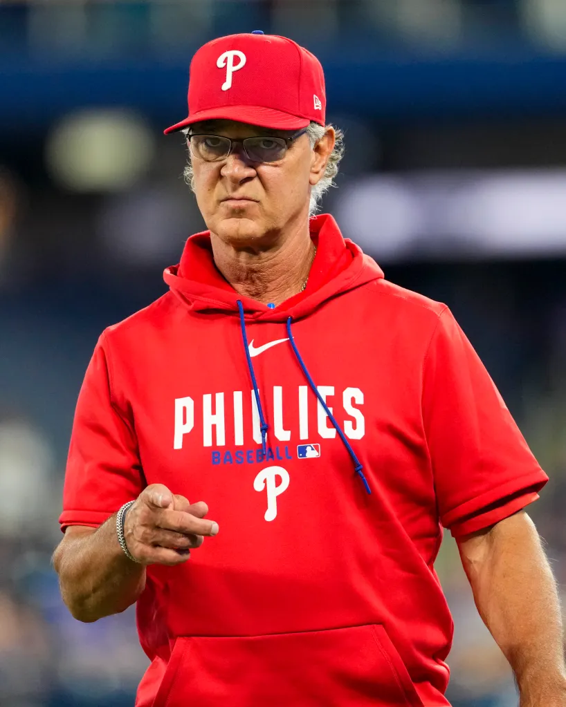 Don Mattingly, interim manager for the Philadelphia Phillies, points towards the dugout during a game against the Toronto Blue Jays.
