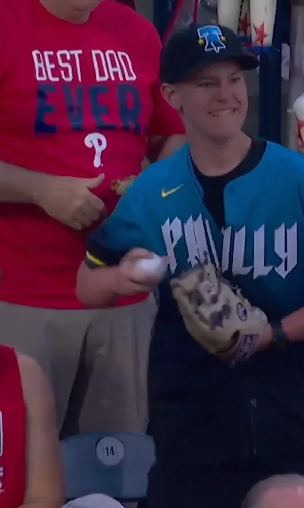 The Phillies fan then throws a phony ball back onto the field on June 21, 2026.