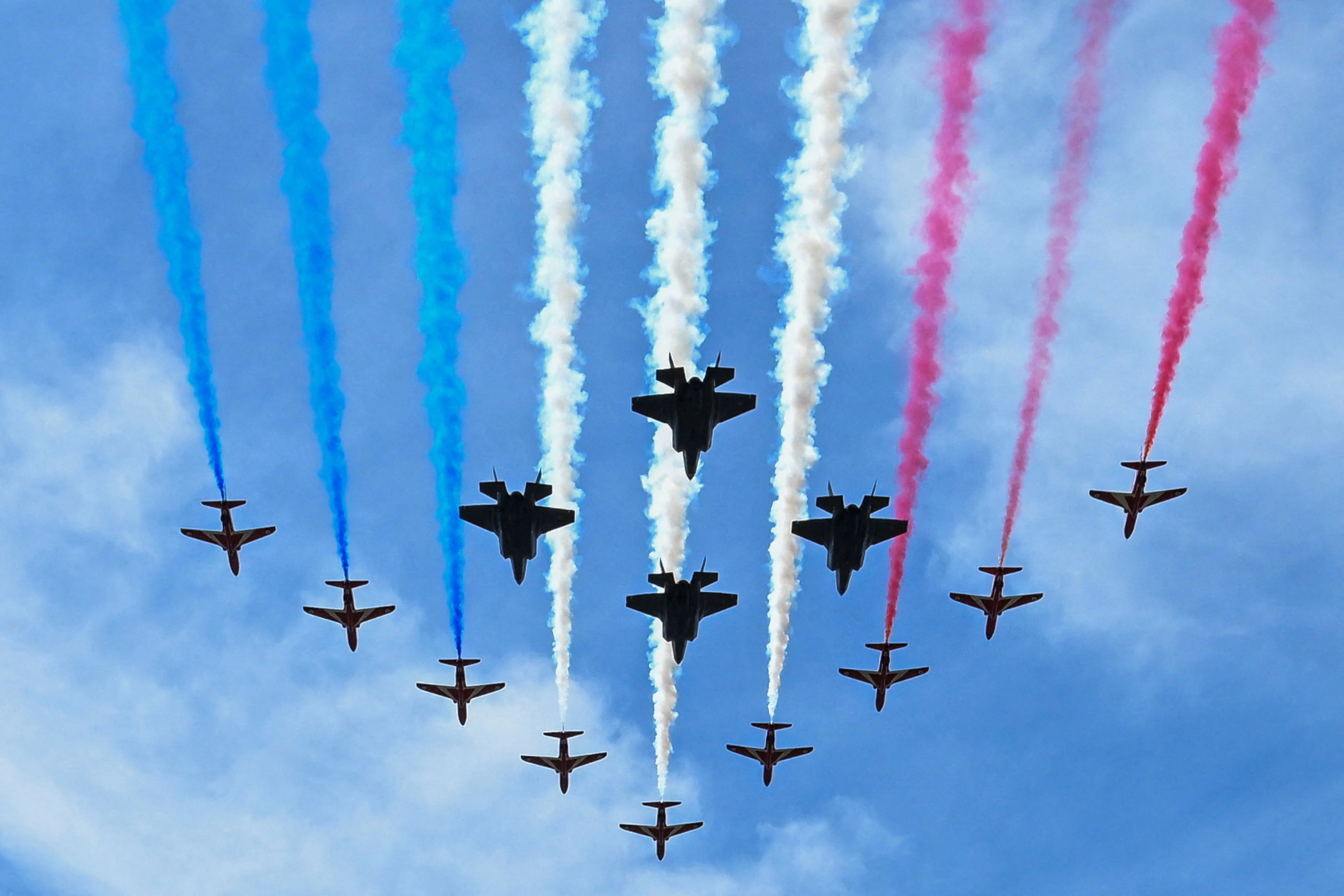 The Red Arrows perform a flypast over Buckingham Palace.