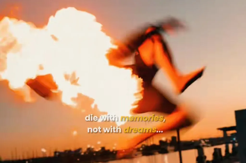 A person engulfed in flames jumps into the sea, with the text "die with memories, not with dreams..." overlayed.