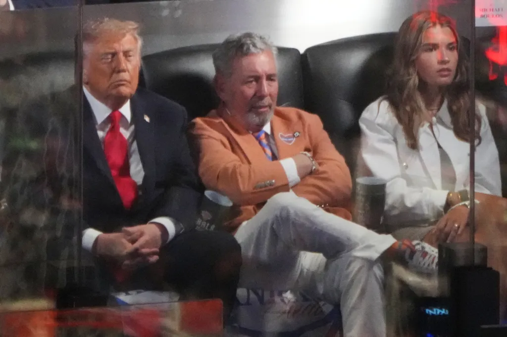 Donald Trump, James Dolan, and Kai Trump watching the NBA Finals.