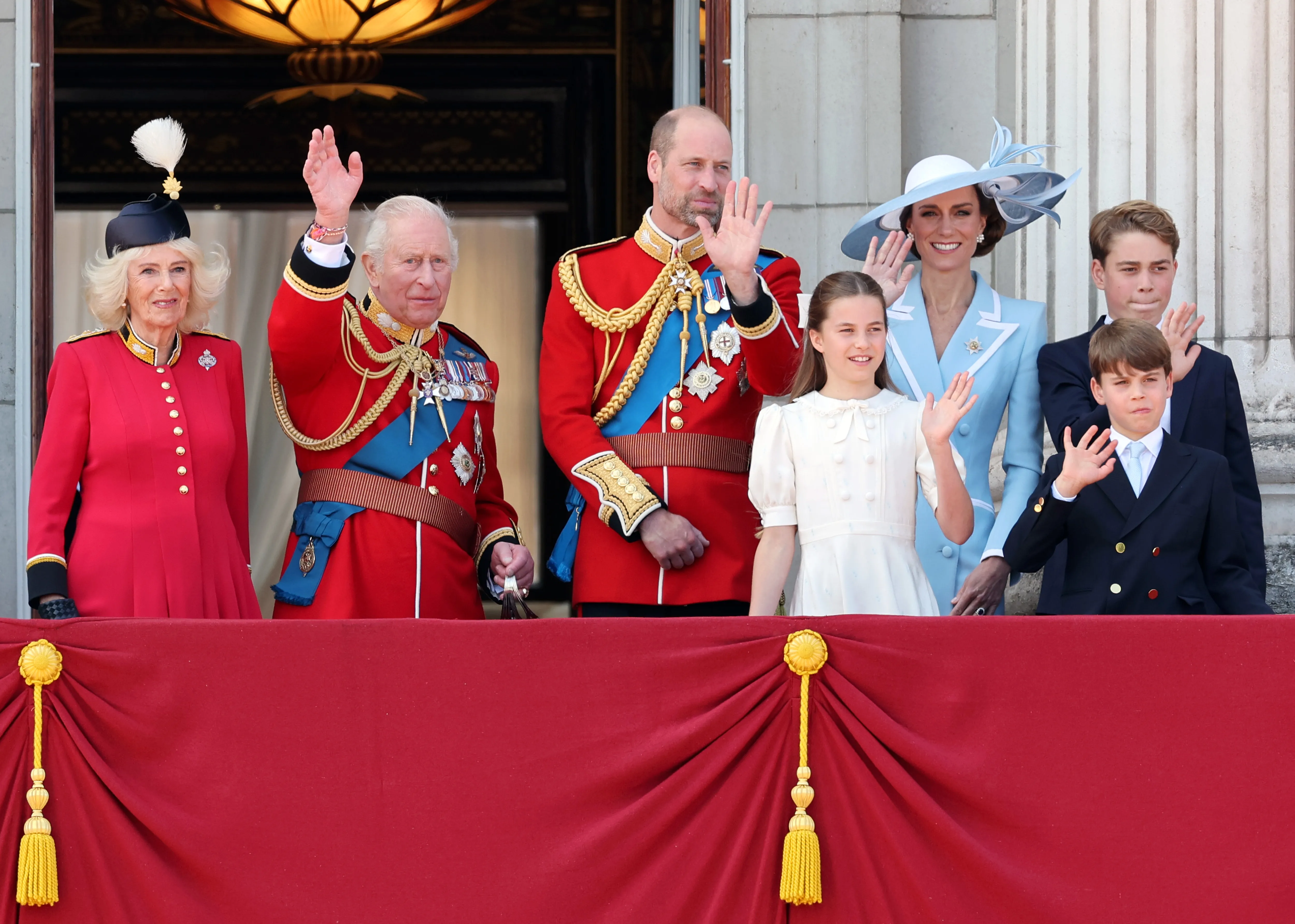 Queen Camilla, King Charles III, Prince William, Prince of Wales, Princess Charlotte of Wales, Catherine, Princess of Wales, Prince George of Wales and Prince Louis of Wales watch an RAF flypast from the balcony of Buckingham Palace during Trooping The Colour in London, England. 