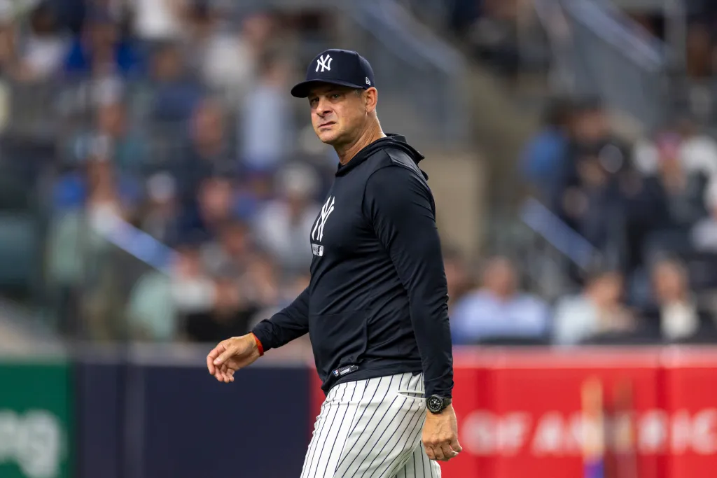 New York Yankees manager Aaron Boone reacts as he walks back to the dugout.