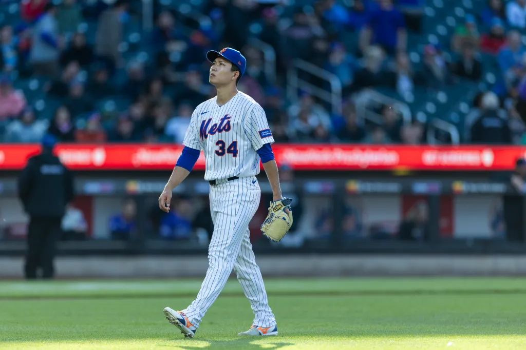 New York Mets pitcher Kodai Senga (34) walks off the field.