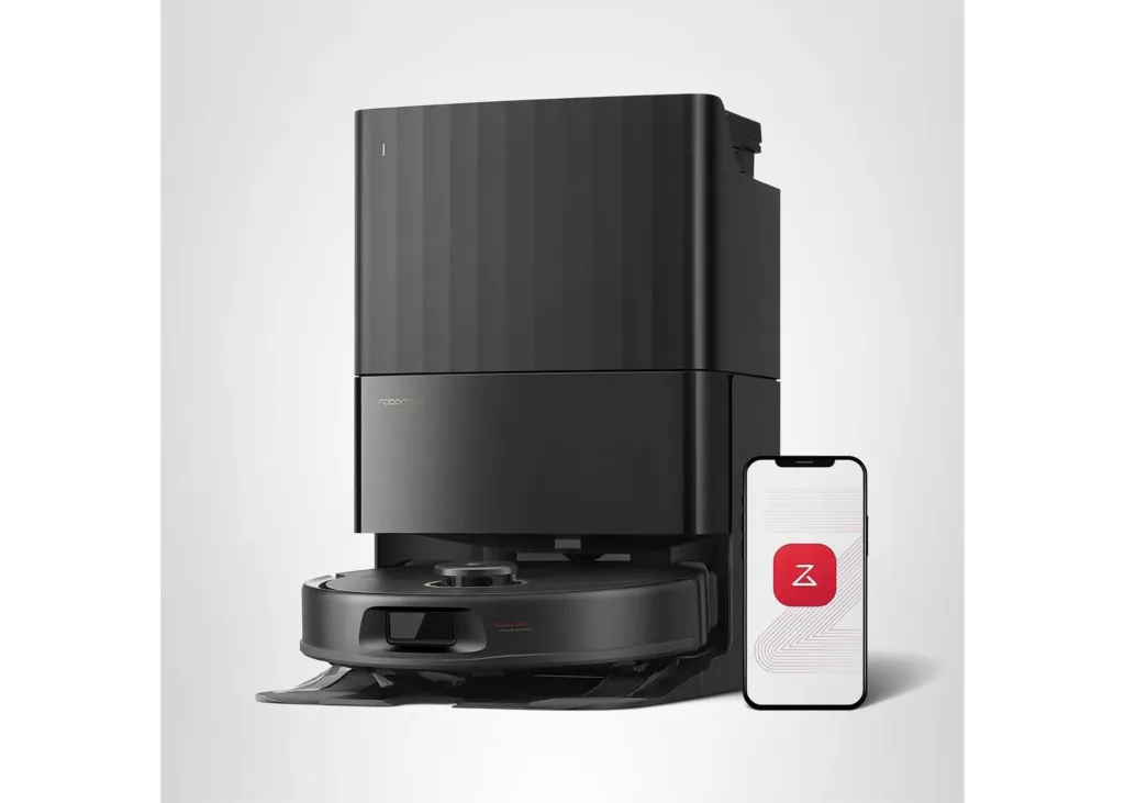 Roborock Q Revo robot vacuum with a smartphone displaying the Roborock app.