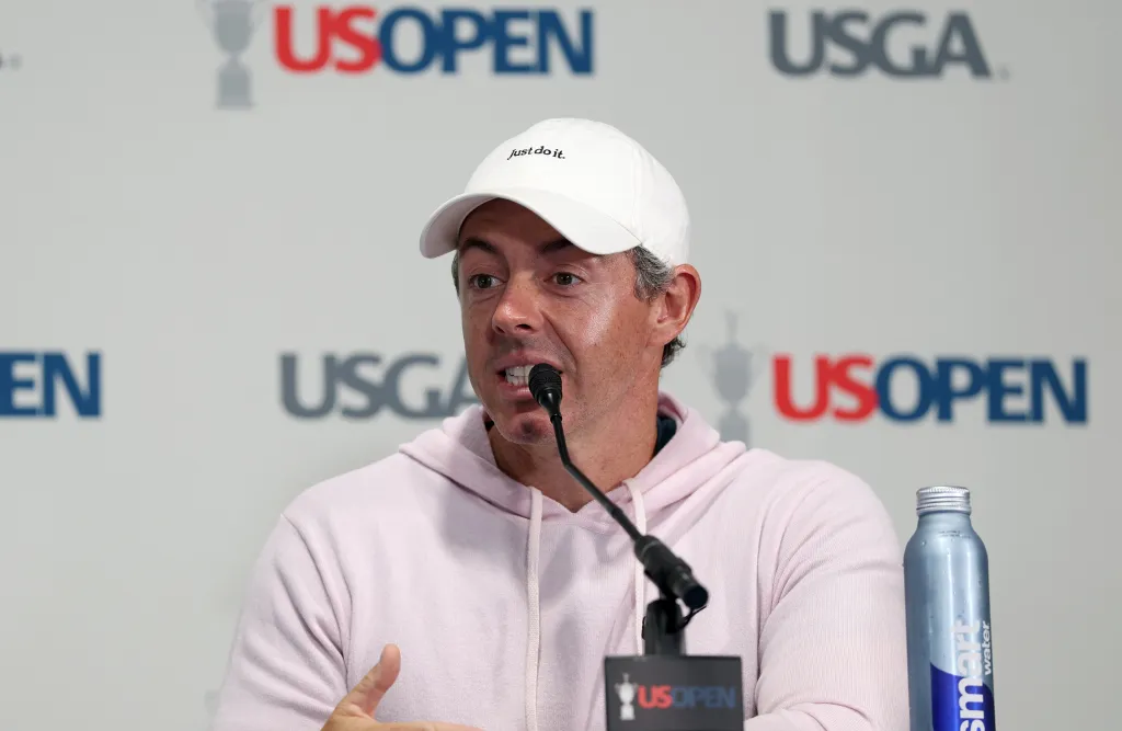 Rory McIlroy speaking at a press conference with "US OPEN" and "USGA" logos in the background.
