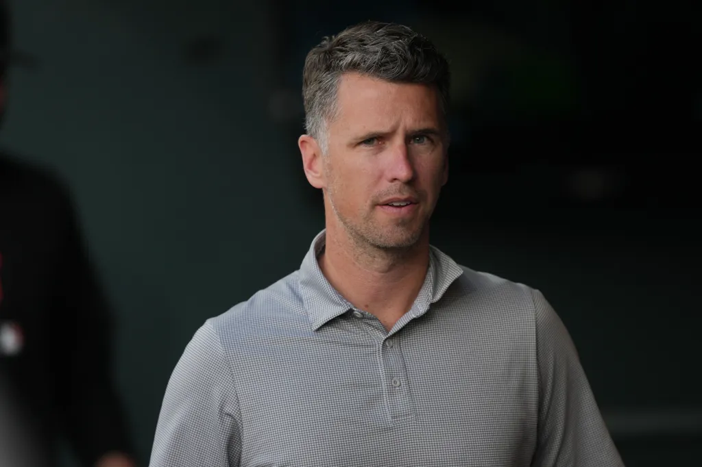 San Francisco Giants president of baseball operations Buster Posey looks on from the dugout