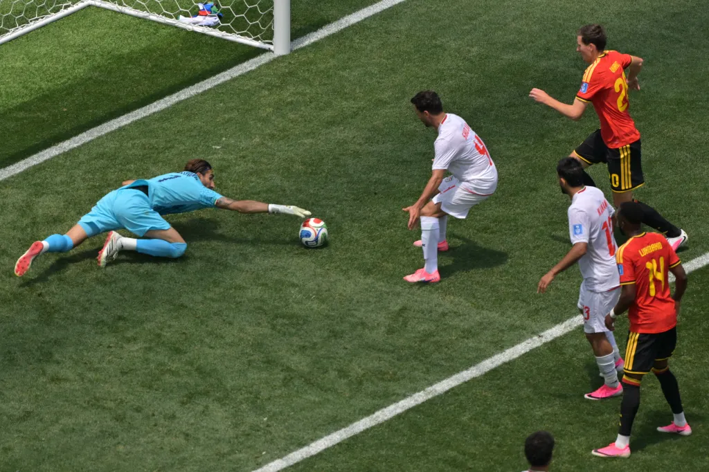 Iran goalkeeper Alireza Beiranvand saves the soccer ball during a World Cup match.