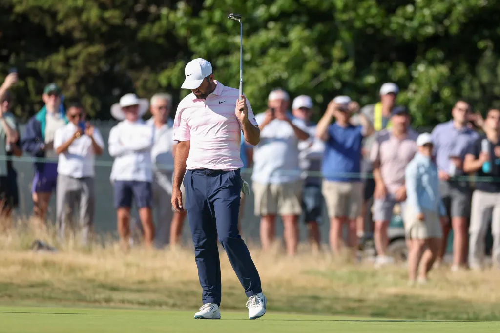 Scottie Scheffler reacts after putting on the 12th green during the final round of the 126th U.S. Open.