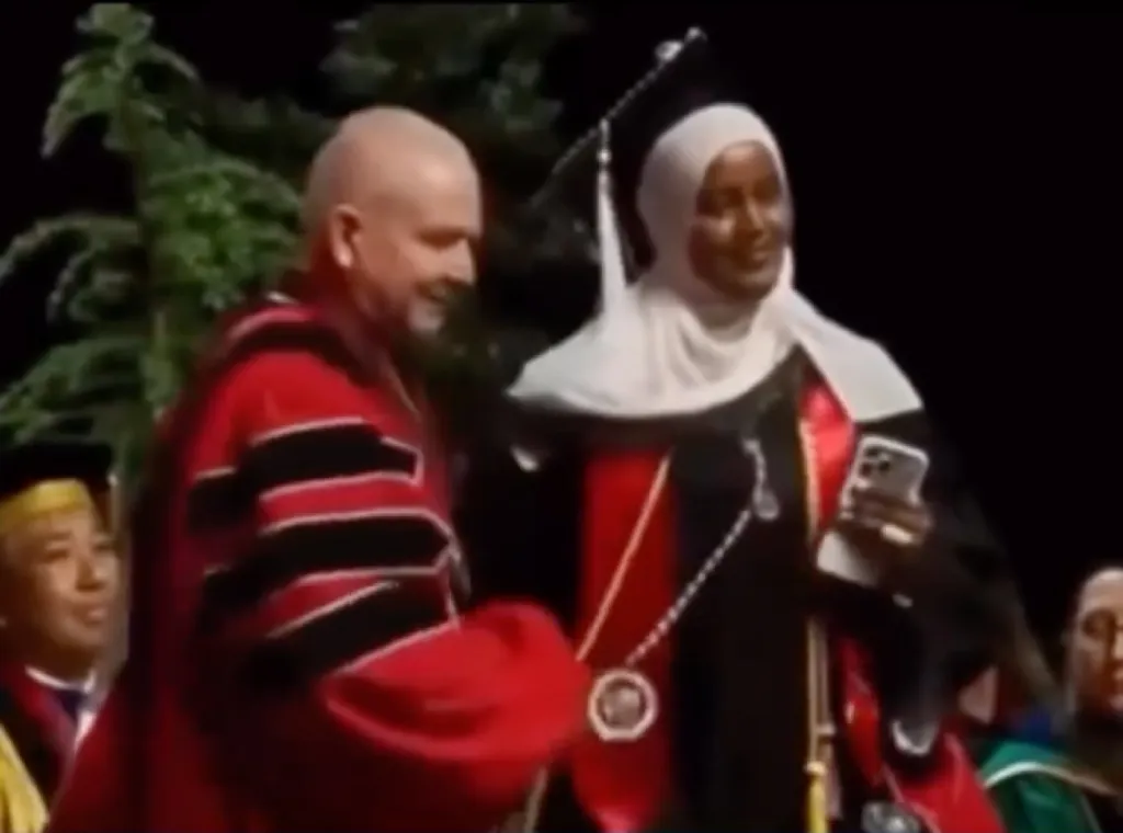 A Seattle University official yanking a Palestinian flag from a graduating student at a commencement ceremony.