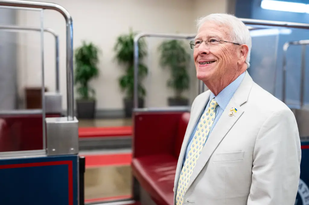 Sen. Roger Wicker, R-Miss., smiling while wearing a suit and tie with an American flag and Ukrainian flag pin on his lapel.