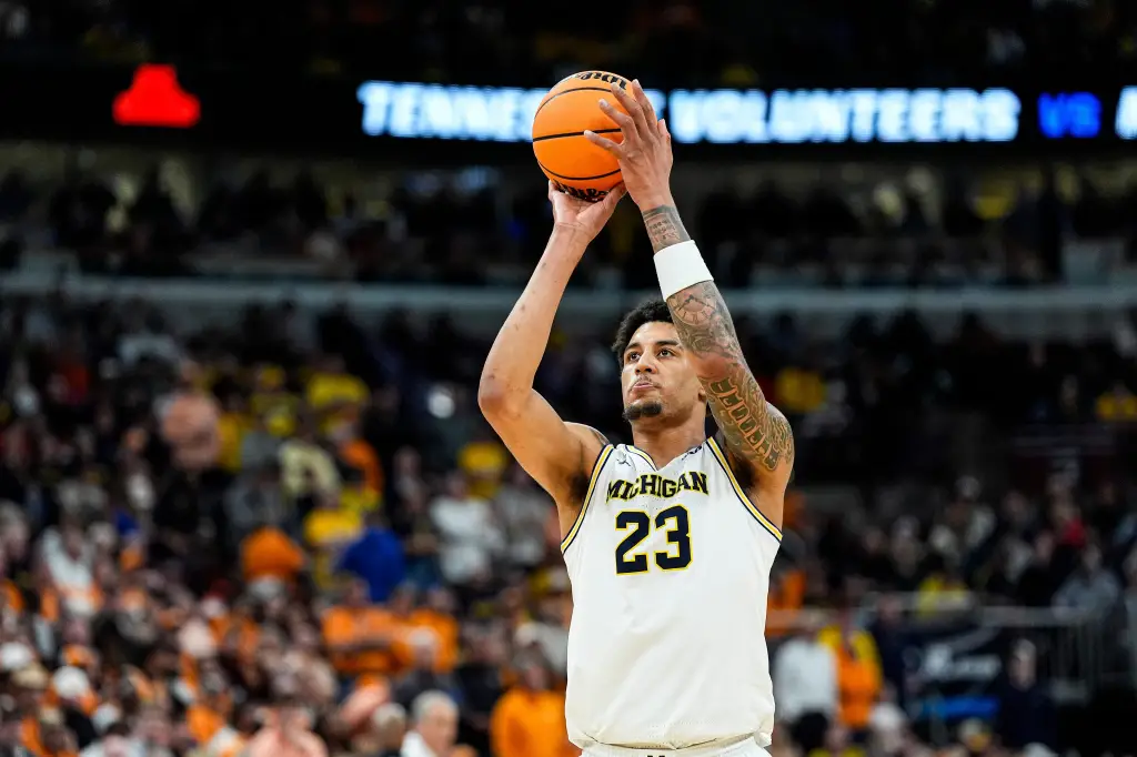 Michigan forward Yaxel Lendeborg (23) shoots a free throw against Tennessee.