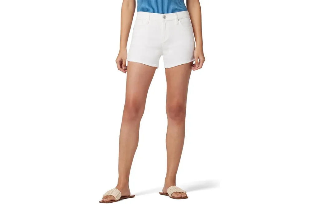 A woman wearing white shorts