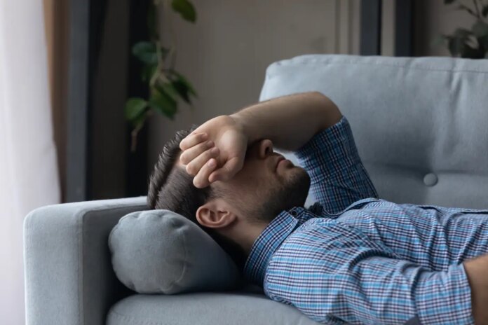 sick-man-feeling-headache-migraine-129226593.jpg