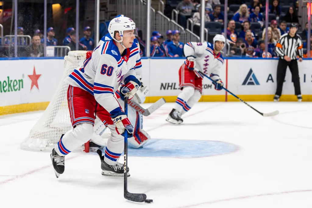 New York Rangers defenseman Scott Morrow (60) skates up ice.