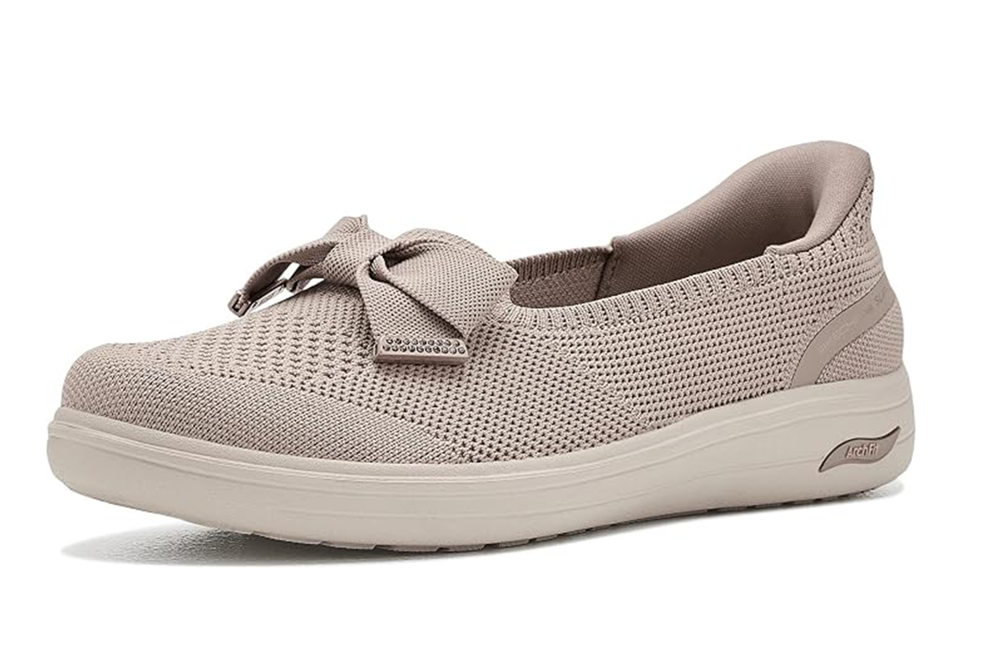 Single Skechers Arch Fit knit flat in light tan with a decorative bow on the vamp.