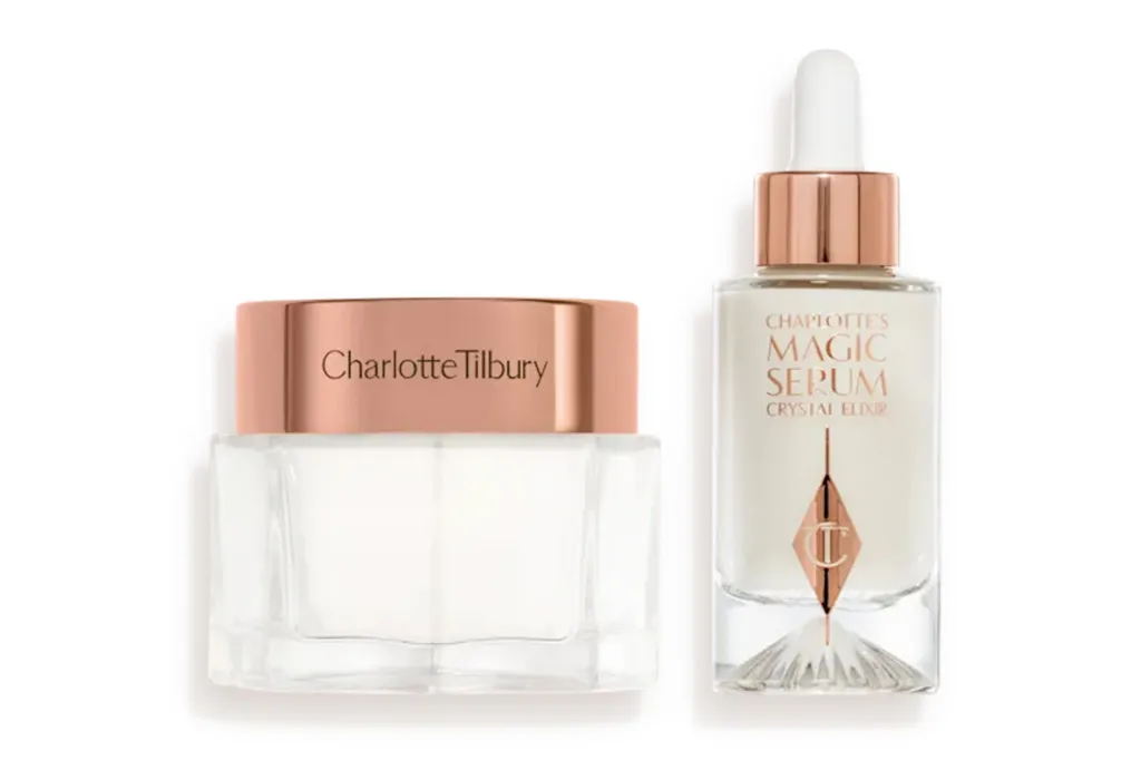Charlotte Tilbury Magic Serum Crystal Elixir bottle next to a Charlotte Tilbury skincare jar.
