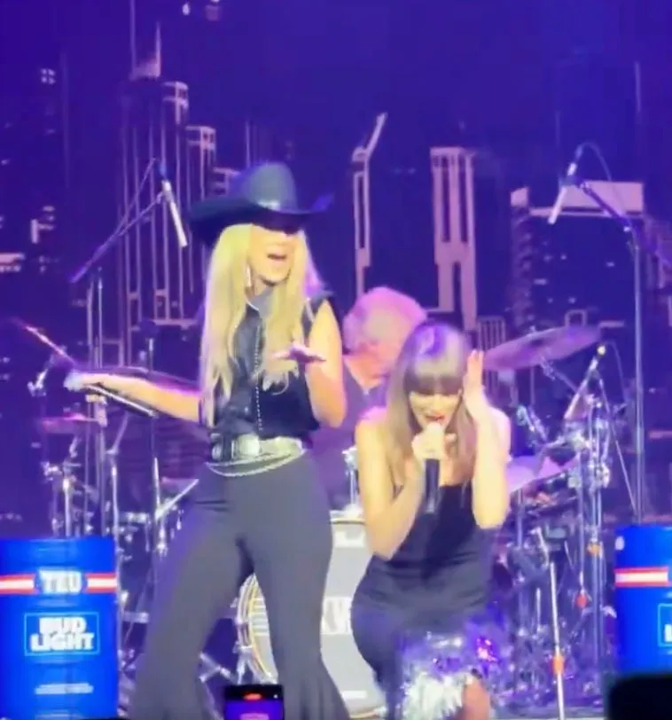 Taylor Swift (R) and Lainey Wilson (L) performed a duet of Swift's song, "Love Story" while at a party for the Tight End University summit in Nashville on Tuesday, June 23, 2026.