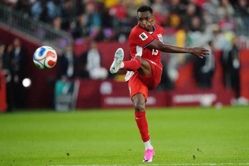 Jiovany Ramos of Panama kicking a soccer ball during a World Cup match.