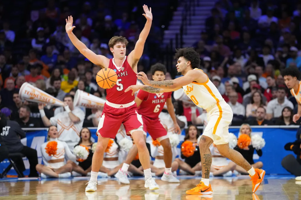 Tennessee Volunteers guard Ja'kobi Gillespie (0) passes the ball as Miami (OH) RedHawks guard Peter Suder (5) defends during an NCAA Tournament game.