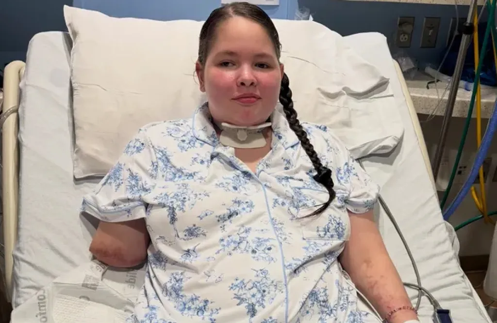 Thirteen-year-old Kaydin Ruiz in a hospital bed after becoming a triple amputee due to severe illness.