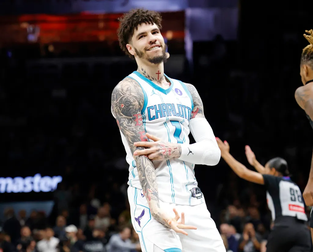 Charlotte Hornets guard LaMelo Ball celebrating after a three-point basket.