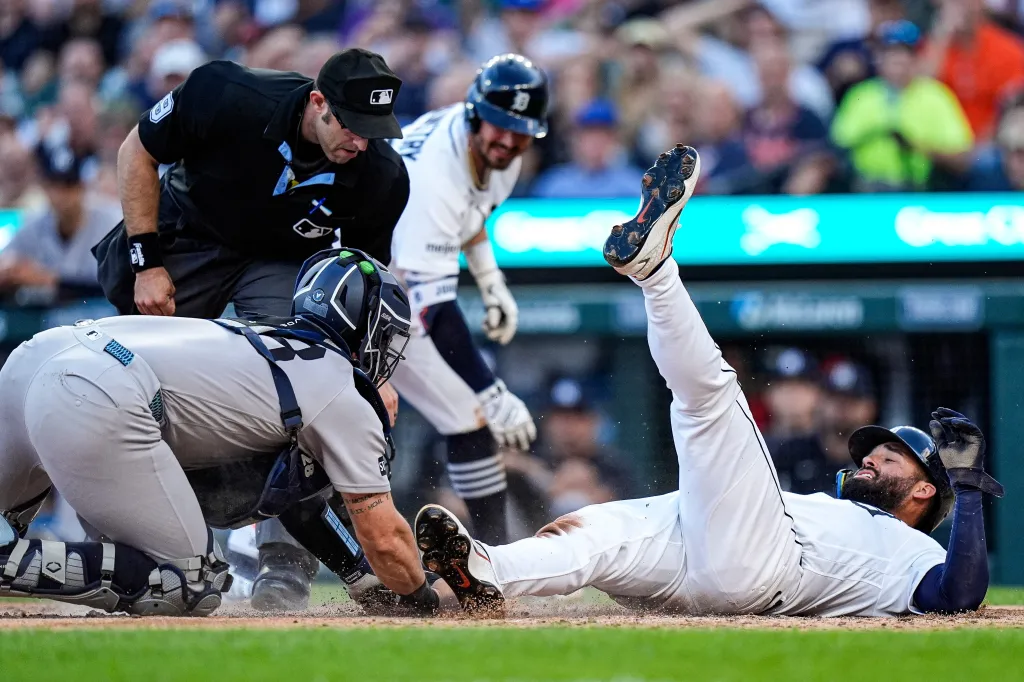 Detroit Tigers left fielder Riley Greene is thrown out at home plate by New York Yankees catcher Austin Wells.